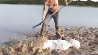 Bandaged Woman Buried In Mud - nude porn video