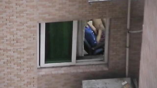 Blonde Asian fingering at window - nude porn video
